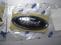 Эмблема крышки багажника Форд Фокус 1 Хэтчбек 1021061, - Ford 