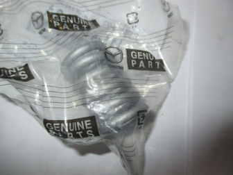 Пружина приемной трубы YJ1540582A Мазда 6 - Mazda